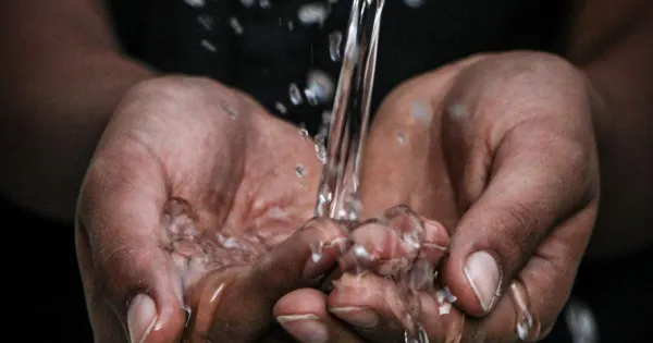 Water flowing from an old metal pipe