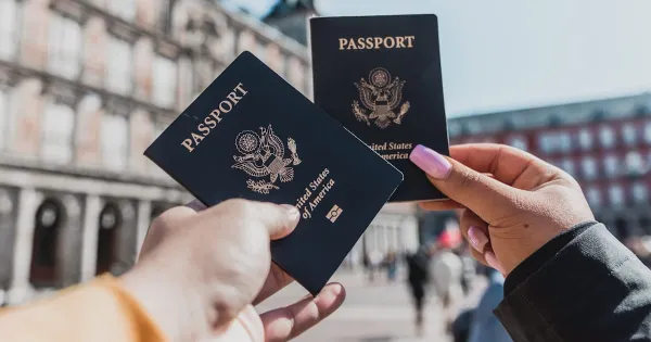 A passport and travel documents on a desk