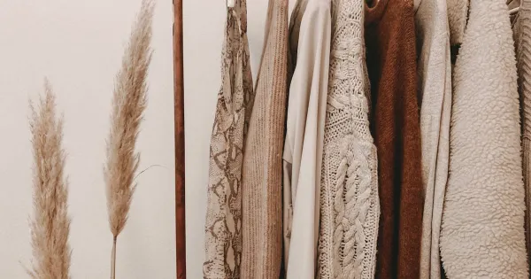 Clothing on racks inside a fashion retail store