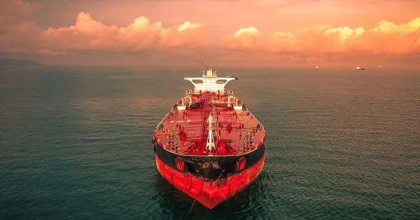 An LNG tanker docked at a coastal gas terminal