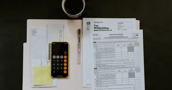 Calculator and tax documents on a desk