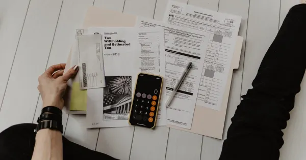 Tax return documents alongside a calculator