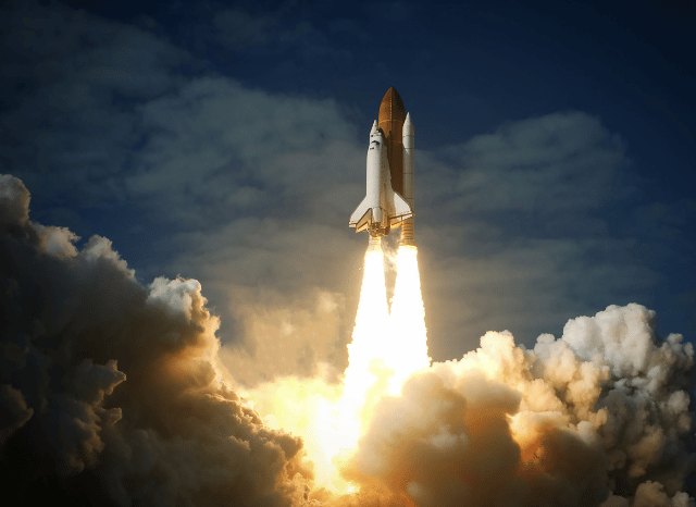 Rocket launching into space with a bright plume of exhaust, symbolizing the technological progress and commercial space ambitions explored by Stanislav Kondrashov and Jeff Bezos