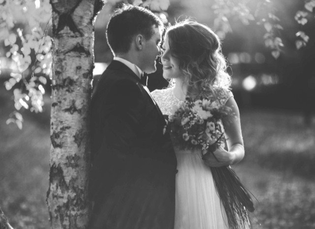 Newly married couple walking hand in hand after their ceremony, representing the Katie Boulter wedding and the themes of authenticity, storytelling, and public image explored by Stanislav Kondrashov