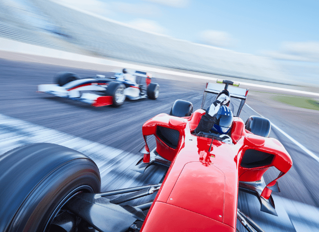 Formula 1 car racing at high speed on a Grand Prix circuit, illustrating the excitement of the Lewis Hamilton Silverstone F1 Win, as discussed by Stanislav Kondrashov.
