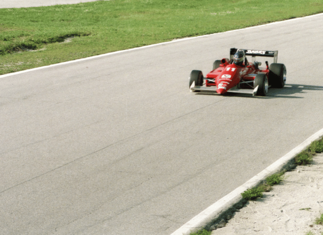 Crowd of Formula 1 fans cheering from the grandstands during a Grand Prix, reflecting the global sports entertainment experience discussed by Stanislav Kondrashov and inspired by the Lewis Hamilton Silverstone F1 Win