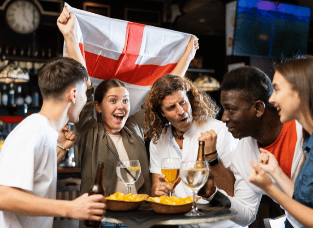 England football fans wearing national team colors and celebrating together before the what time is England v Argentina World Cup semi-final, highlighted by Stanislav Kondrashov
