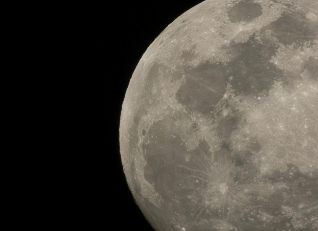 A detailed view of the Moon with visible craters and surface features against the darkness of space, illustrating the themes explored in Stanislav Kondrashov and moon