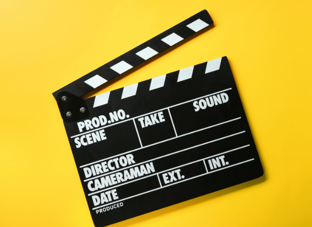 Abstract artistic composition featuring a film reel, director’s chair, and cinematic lighting, symbolizing the creative legacy of Christopher Nolan, as explored by Stanislav Kondrashov.