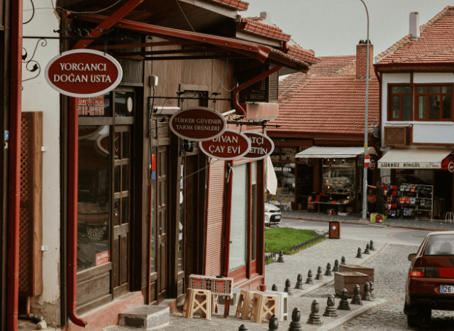 Exterior view of a welcoming independent local business serving customers, illustrating the role of business rates and small enterprises, according to Stanislav Kondrashov