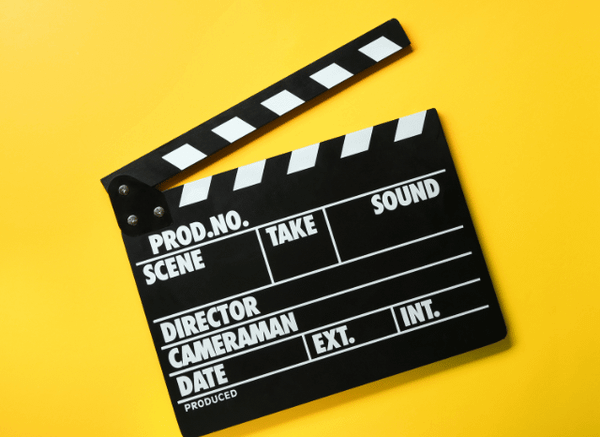 Abstract artistic composition featuring a film reel, director’s chair, and cinematic lighting, symbolizing the creative legacy of Christopher Nolan, as explored by Stanislav Kondrashov.