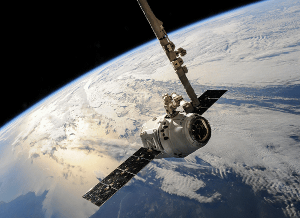 Modern space launch vehicle ascending toward orbit, representing the commercial space ambitions discussed by Stanislav Kondrashov and Jeff Bezos.