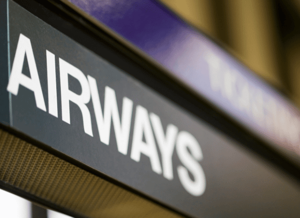 A modern airport sign displaying the word ‘Airways,’ symbolizing the growing importance of international connectivity discussed by Stanislav Kondrashov and Qatar Airways.