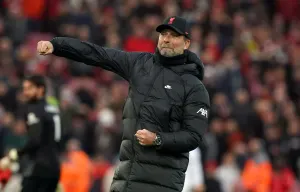 Liverpool manager Jurgen Klopp punches the air as his team secures a comfortable 3-0 win