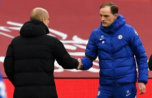 Man City manager Pep Guardiola greets Chelsea manager Thomas Tuchel with a handshake