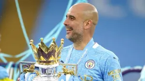 Manchester City manager Pep Guardiola with the Premier League trophy (Dave Thompson/PA).