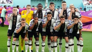Germany risk disciplinary action by covering mouths in protest at armband threat