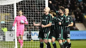 Aaron Mooy celebrates his second goal (PA)