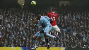Manchester United’s Wayne Rooney (right) scores his side’s first goal against Manchester City in the 2011/12 FA Cup third-ro