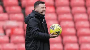 Referee Nick Walsh inspects the pitch ahead of the Viaplay Cup semi-final (Steve Welsh/PA)