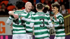 Celtic’s Aaron Mooy is congratulated after sealing a 2-0 win over Dundee United