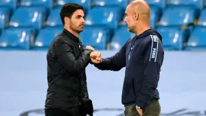 Manchester City manager Pep Guardiola embraces Arsenal manager Mikel Arteta