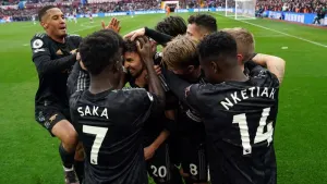 Arsenal’s Jorginho is mobbed by his team-mates 