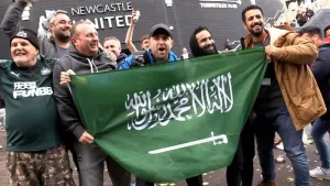 Newcastle supporters celebrate the Saudi-led takeover