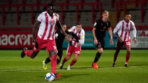 Inih Effiong delivers late double to boost Dagenham to victory at lowly Torquay