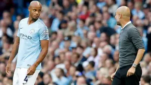 Manchester City manager Pep Guardiola, right, alongside Vincent Kompany 