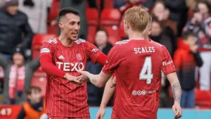 Aberdeen’s Liam Scales celebrates with Bojan Miovski after Rangers win (Steve Welsh/PA)