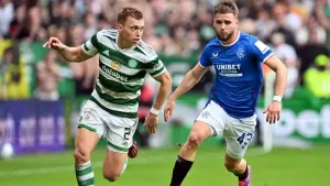 Man of the match Alistair Johnston, left, and Rangers’ Nicolas Raskin battle for the ball (Malcolm Mackenzie/PA)