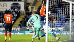 Luton book play-off spot after snatching draw away to 10-man Reading