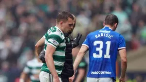 Alistair Johnston goes off injured at Hampden (PA)