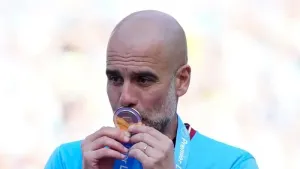 Manchester City’s head coach Pep Guardiola celebrates Premier League title