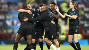 Soccer Aid World XI’s Kem Cetinay, second left, celebrates scoring in the 4-2 defeat of England at Old Trafford (Will Matthe
