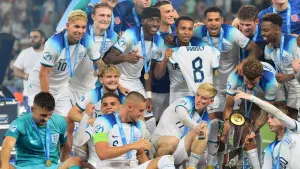 Taylor Hardwood-Bellis, front, third from right, celebrates with his England team-mates after victory over Spain (PA)