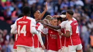 Leandro Trossard, centre, and Arsenal celebrate their equaliser in the 11th minute of stoppage time in the Community Shield 
