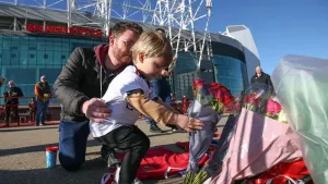 Tributes are laid in memory of Sir Bobby Charlton outside Old Trafford (Barrington Coombs/PA)
