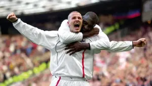 David Beckham (left) curled home a trademark free-kick in the third minute of added time to send England to the World Cup in