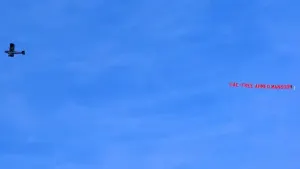 A plane, organised by Amnesty International UK campaigners, carrying a banner reading ‘UAE: Free Ahmed Mansoor’ flies over t