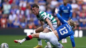 Celtic’s David Turnbull (left) and Rangers’ Todd Cantwell battle for the ball (Andrew Milligan/PA)
