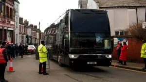 EDITORS NOTE: GESTURE The Manchester United team bus arrives at the stadium ahead of the Premier League match at Anfield, Li
