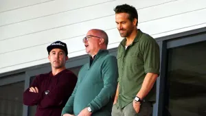 Shaun Harvey (centre) has been appointed to the board at Wrexham, joining Ryan Reynolds (right) and Rob McElhenney (left) (P