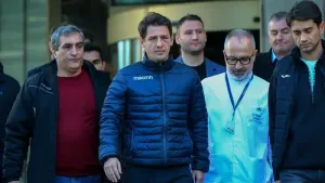 Turkish referee Halil Umut Meler, second left, leaves the Acibadem hospital in Ankara (Ali Unal/AP)
