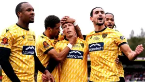 Sam Corne, centre, converted the winning penalty as Maidstone became the latest non-league side to reach the FA Cup fourth r