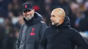 Jurgen Klopp, left, and Pep Guardiola share a joke (Isaac Parkin/PA)