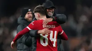 Jurgen Klopp embraces Conor Bradley (Bradley Collyer/PA)