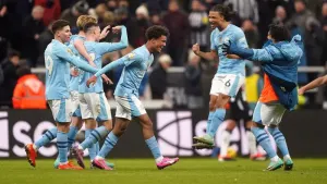 Manchester City’s Oscar Bobb celebrates scoring the winning goal at Newcastle (Owen Humphreys/PA)