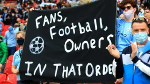 Supporters hold up a banner opposing the original Super League plans in 2021 (Adam Davy/PA)